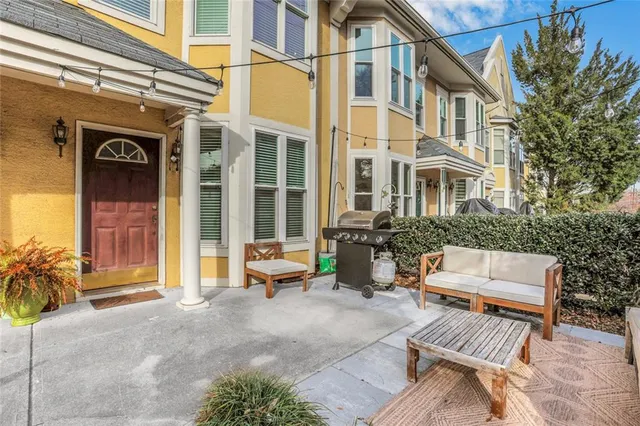 a view of a building with outdoor seating