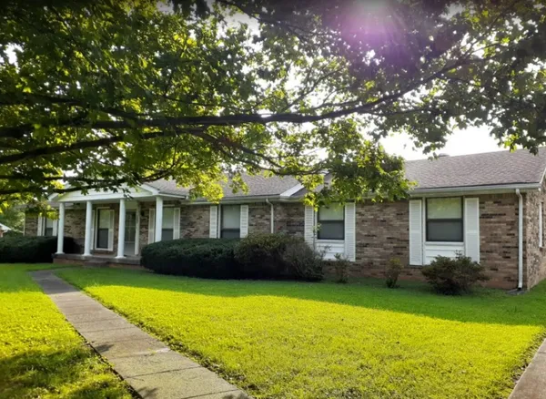 a view of a house with a garden