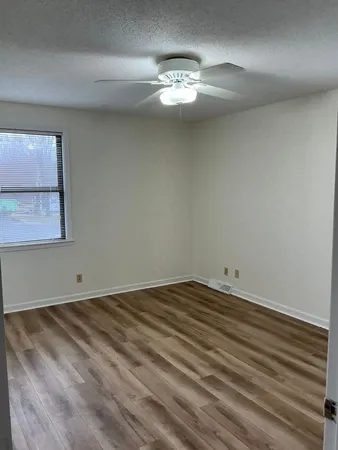 a view of a room that has a lot of cabinets