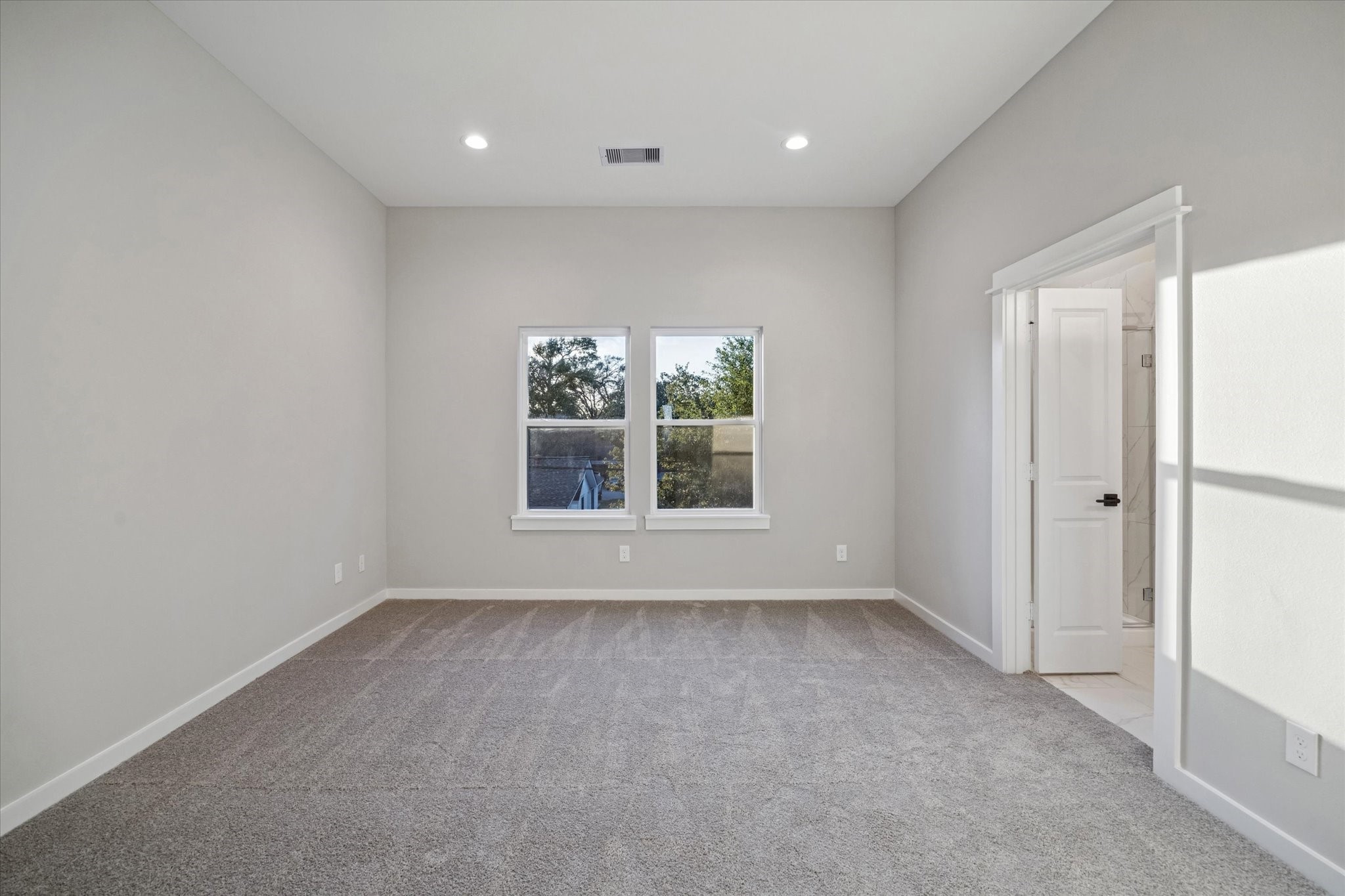 11307 Stonework Grove Lane Houston, TX 77076 - Photo 38 of 46 a view of an empty room with a window