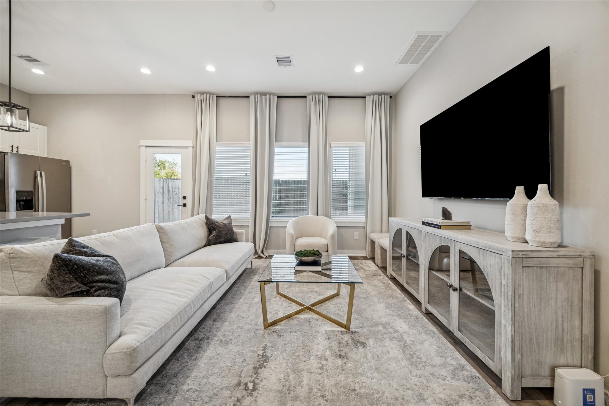 11307 Stonework Grove Lane Houston, TX 77076 - Photo 5 of 46 a living room with furniture and a flat screen tv