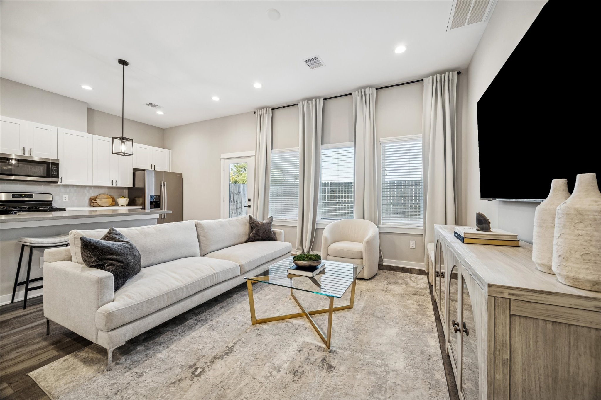 11307 Stonework Grove Lane Houston, TX 77076 - Photo 6 of 46 a living room with furniture and a large window