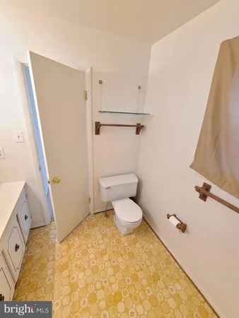 a bathroom with a toilet and a tub