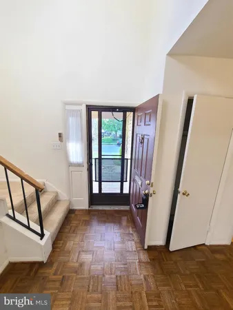 a view of a hallway with staircase