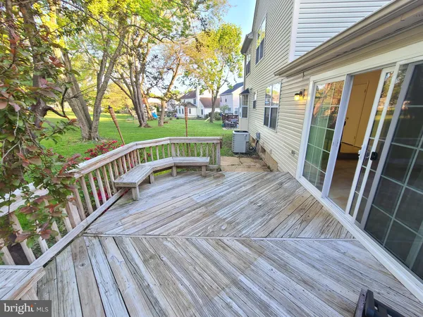 a view of deck with wooden floor and fence