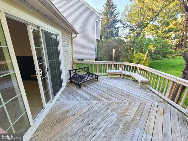 a view of balcony with hardwood and door