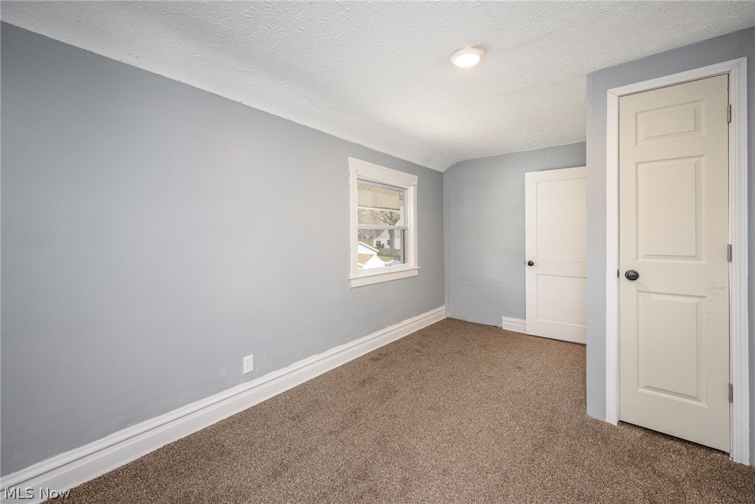 1603 Hampton Road Akron, OH 44305 - Photo 23 of 50 Unfurnished bedroom with carpet flooring and a textured ceiling