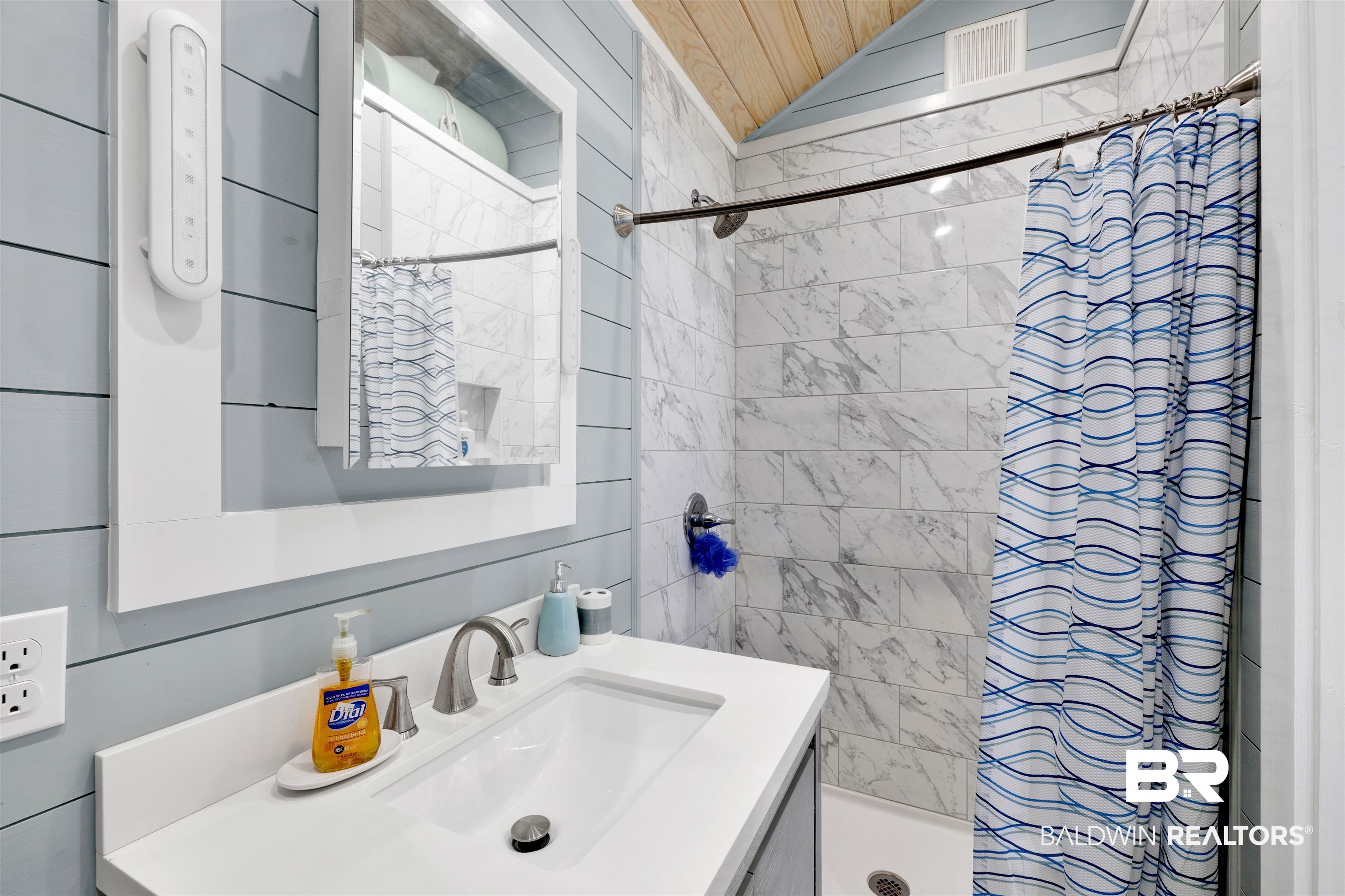 4650 Griffith Marina Road, Unit LOT 24 Orange Beach, AL 36561 - Photo 12 of 34 Full bathroom featuring tiled shower, vanity, and lofted ceiling