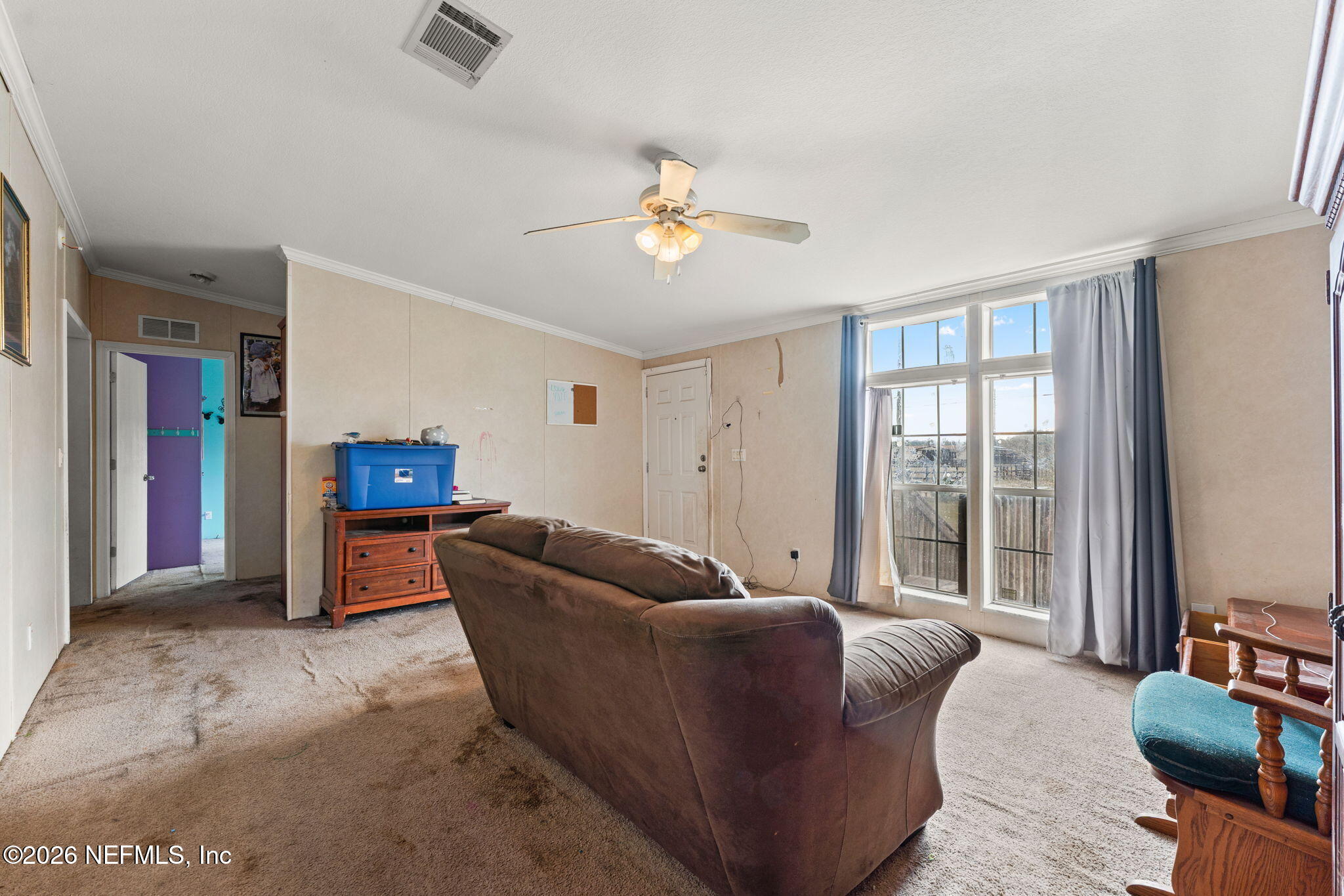 4170 Falcon Run Lane Middleburg, FL 32068 - Photo 4 of 13 a living room with furniture and a flat screen tv