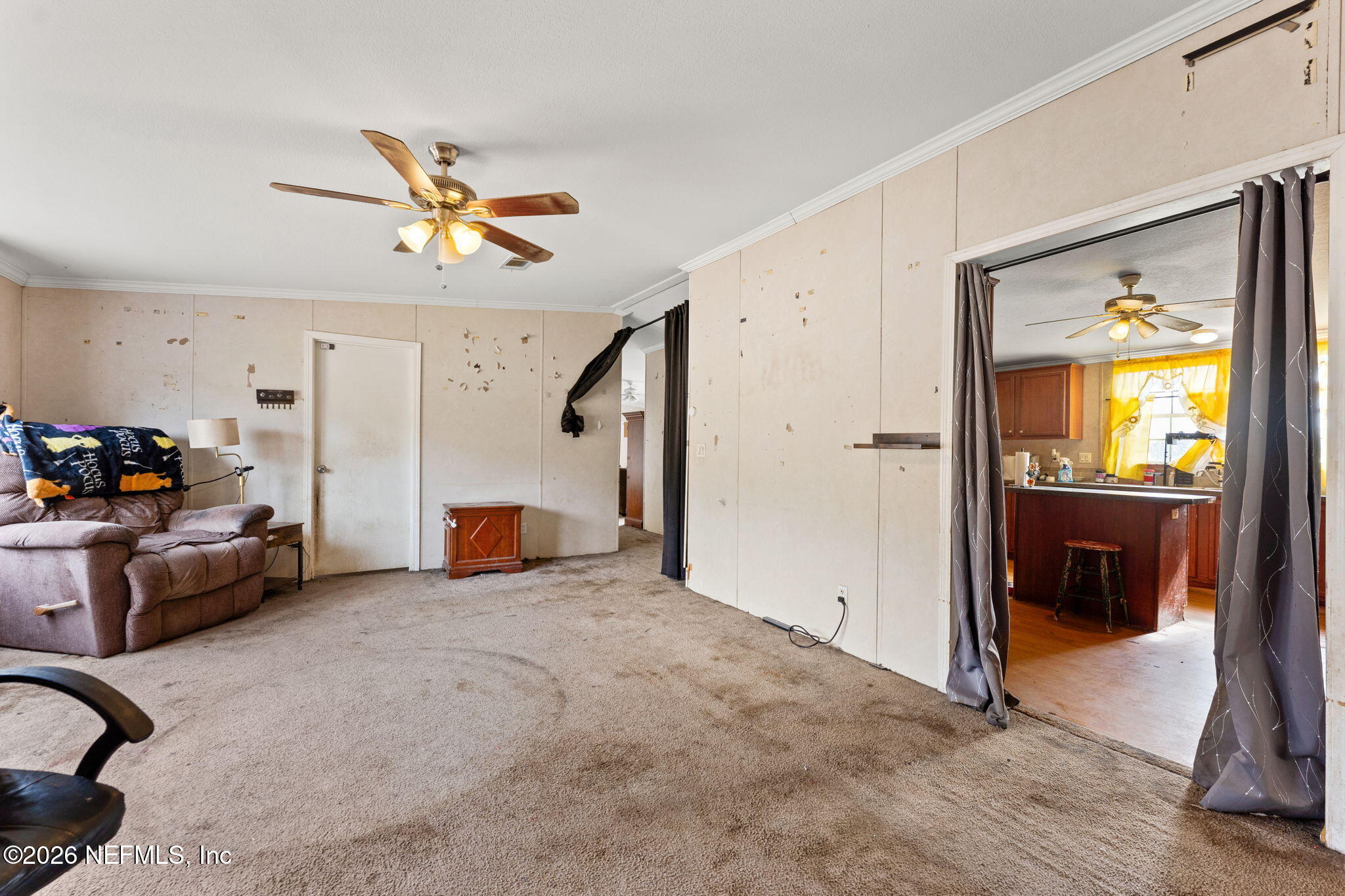 4170 Falcon Run Lane Middleburg, FL 32068 - Photo 8 of 13 a view of a livingroom with furniture and a ceiling fan