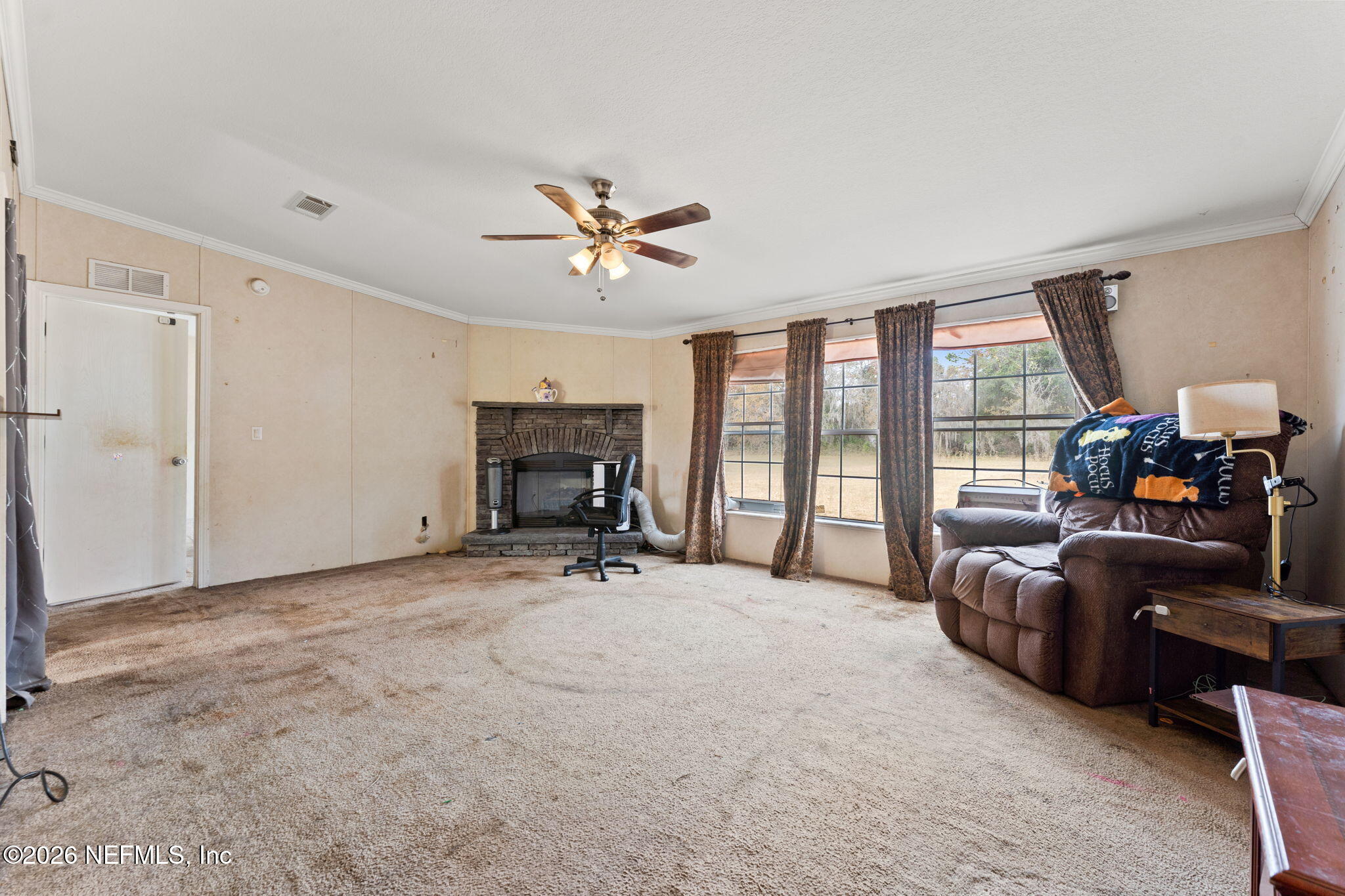 4170 Falcon Run Lane Middleburg, FL 32068 - Photo 9 of 13 a big room with furniture and a large window