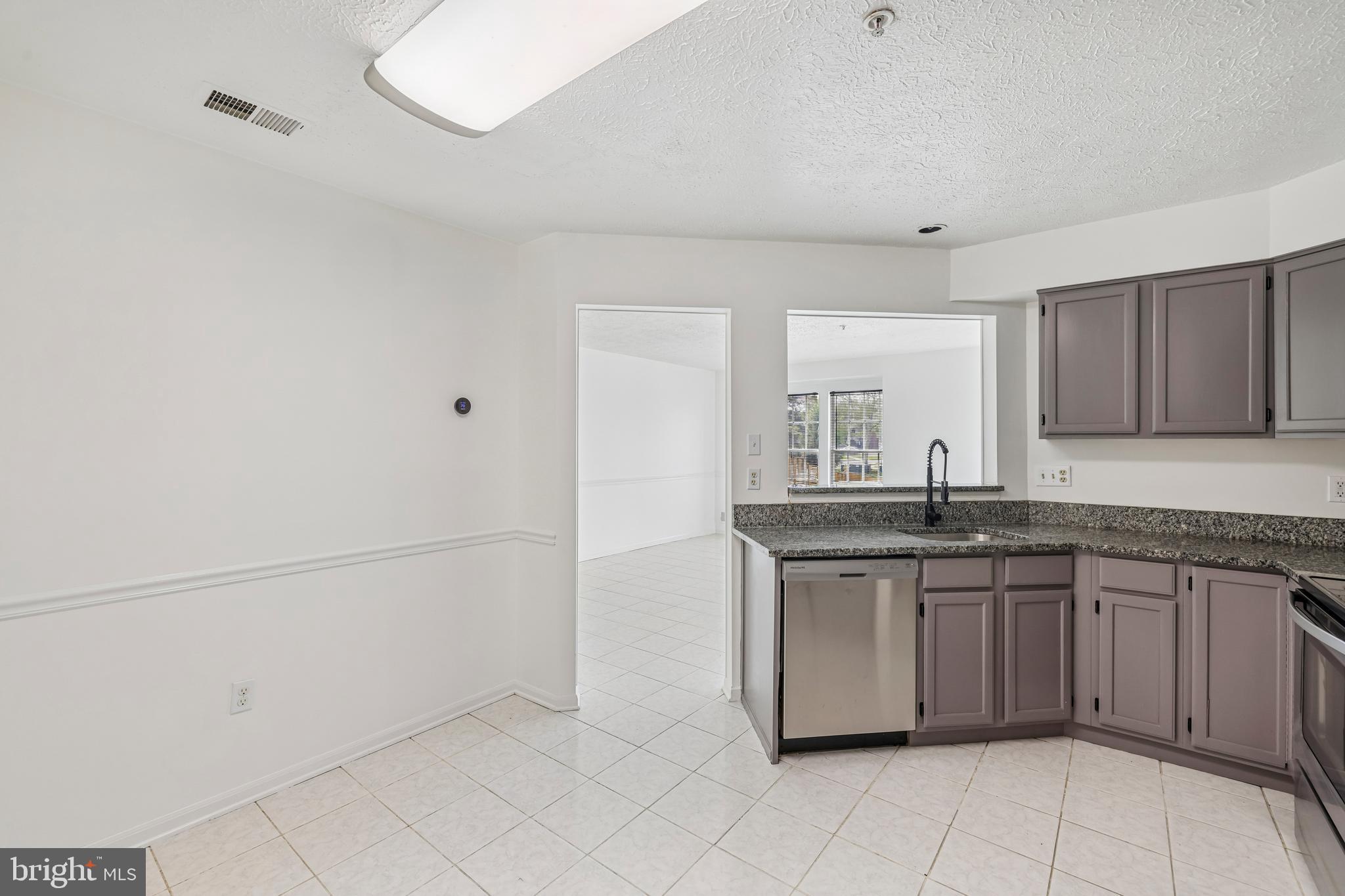 5243 Regal Court Frederick, MD 21703 - Photo 11 of 27 a kitchen with a sink and cabinets