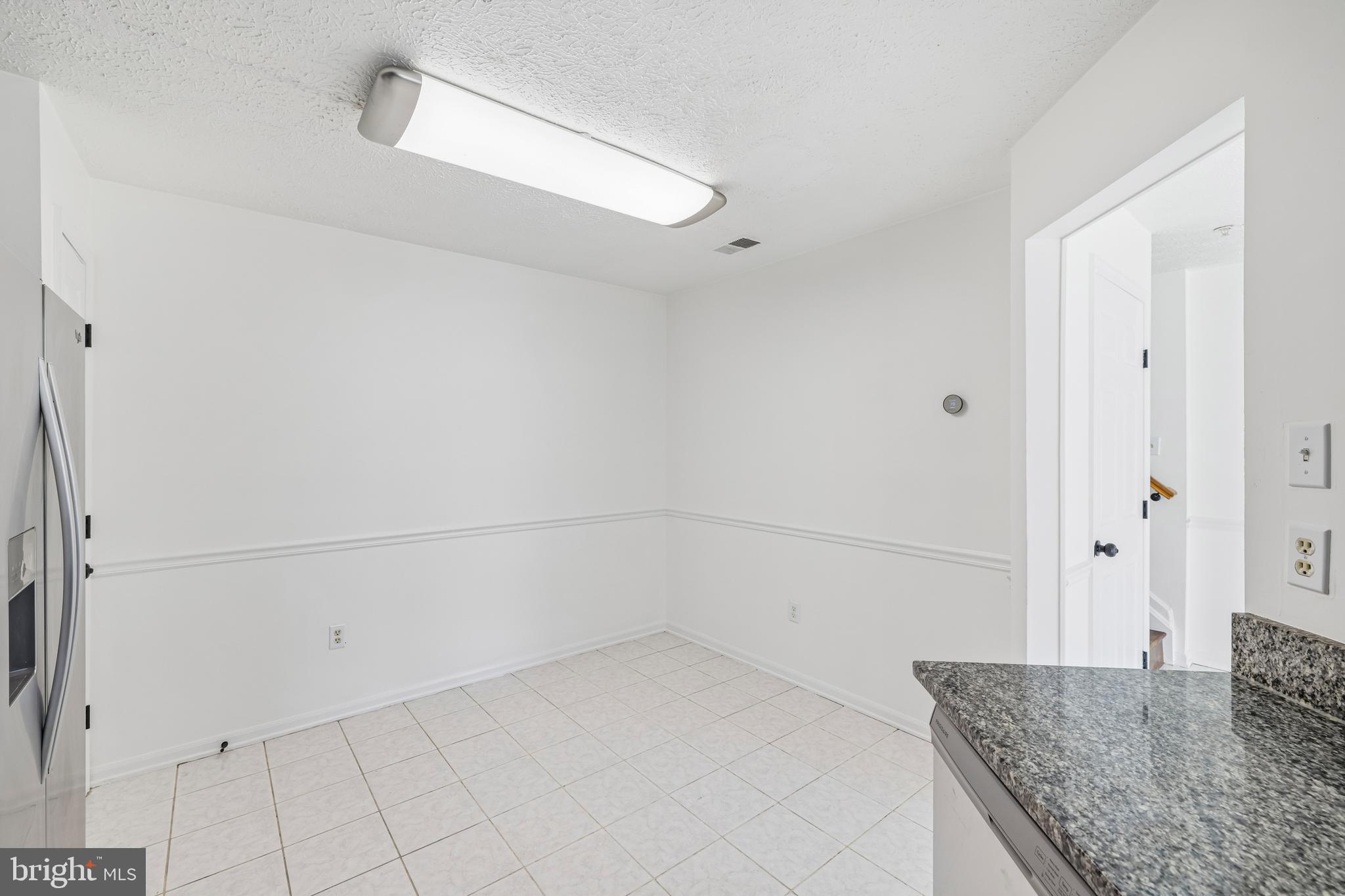5243 Regal Court Frederick, MD 21703 - Photo 12 of 27 a bathroom with a granite countertop sink and a mirror