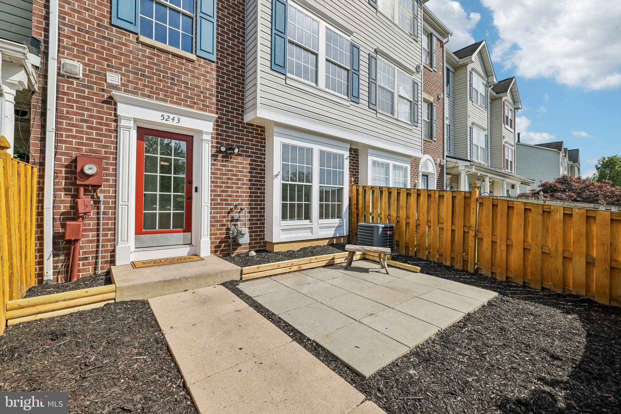 5243 Regal Court Frederick, MD 21703 - Photo 6 of 27 front view of a brick house with a large window