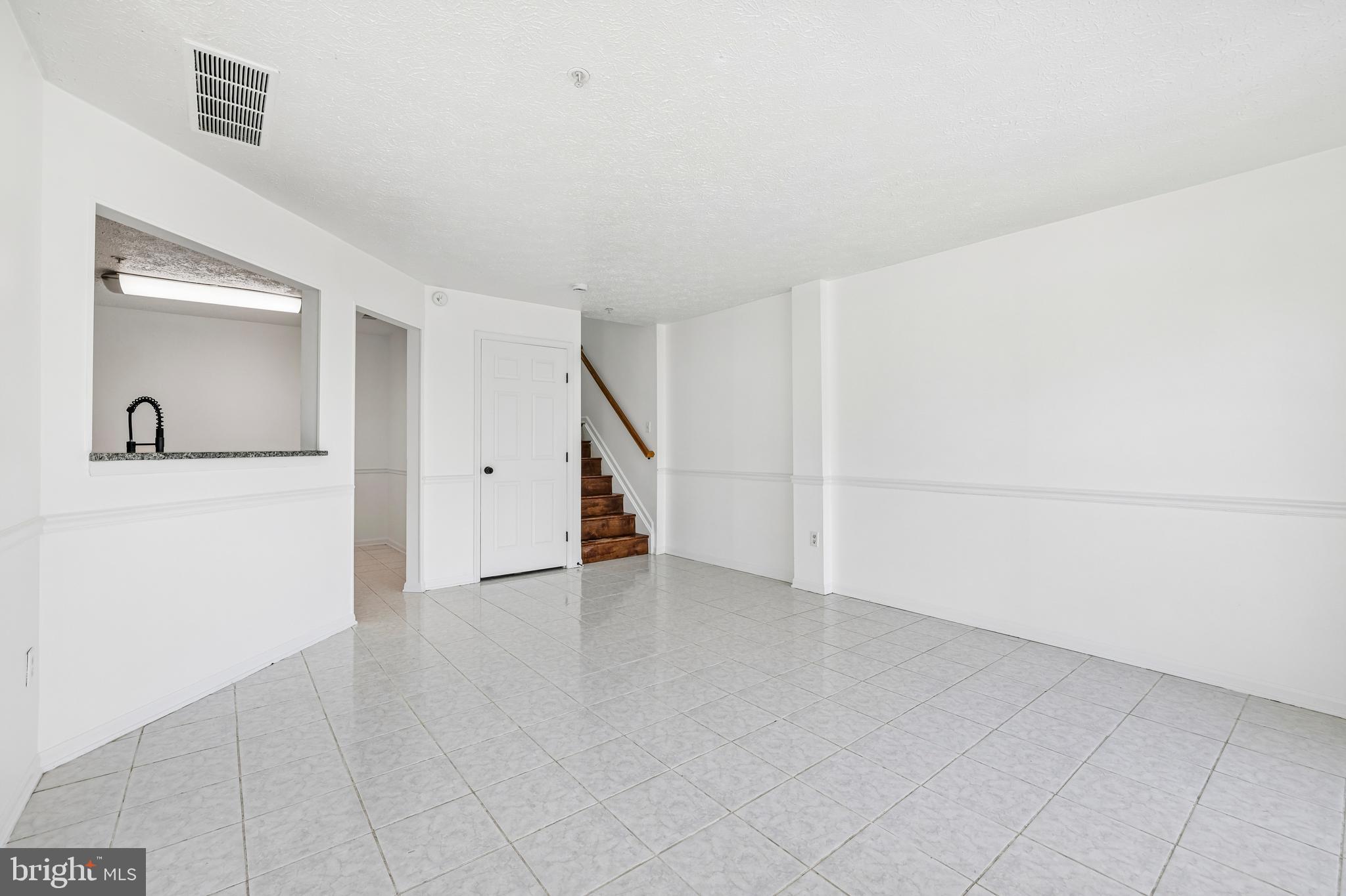5243 Regal Court Frederick, MD 21703 - Photo 7 of 27 an empty room with a bathroom and mirror