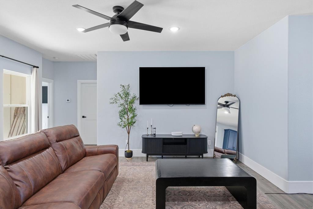 1159 Highway 276 Emory, TX 75440 - Photo 12 of 39 a living room with furniture and a flat screen tv