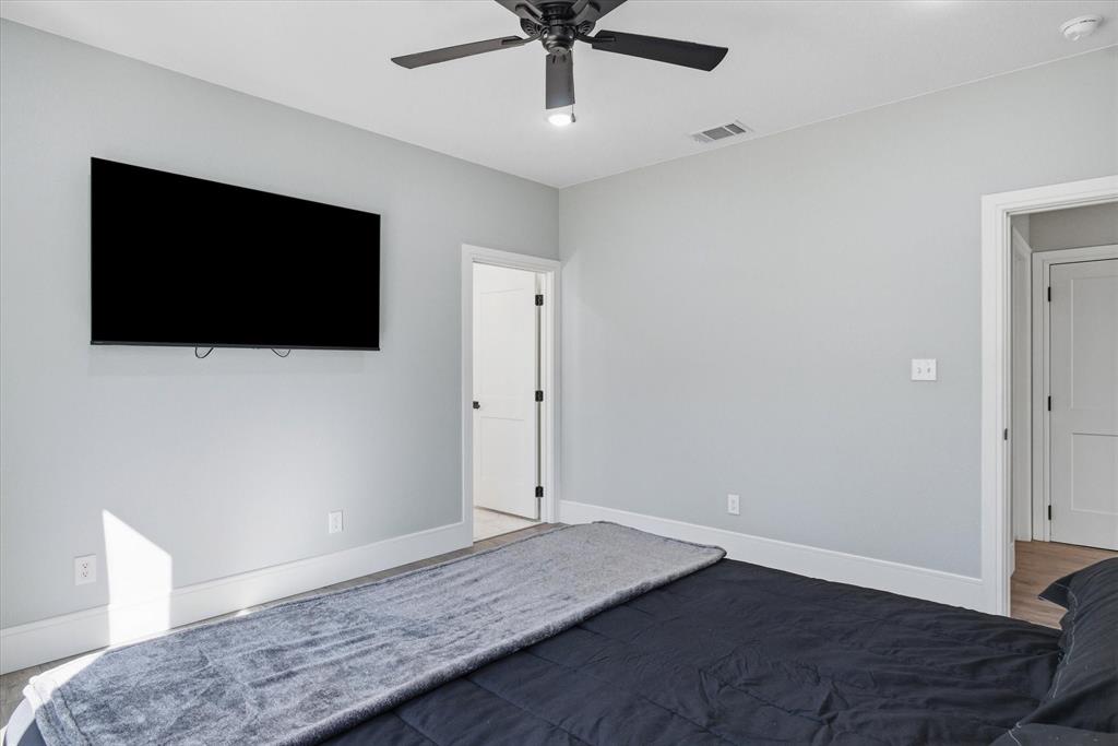 1159 Highway 276 Emory, TX 75440 - Photo 15 of 39 a view of an empty room with a flat screen tv