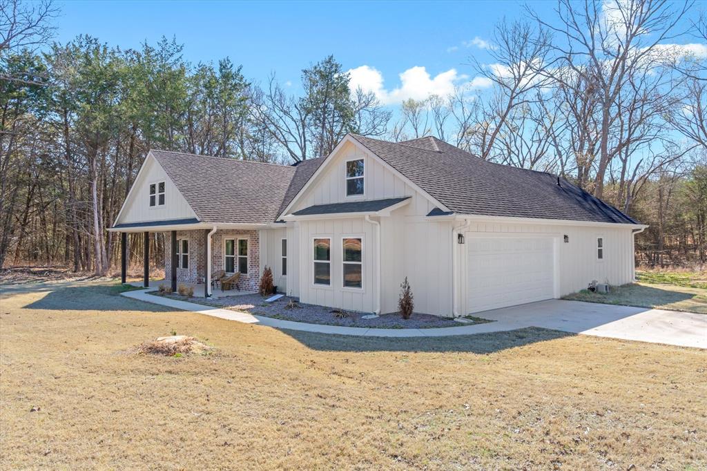 1159 Highway 276 Emory, TX 75440 - Photo 2 of 39 a house with trees in the background