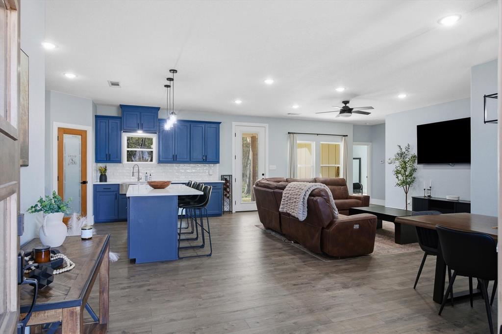 1159 Highway 276 Emory, TX 75440 - Photo 5 of 39 a living room with furniture a flat screen tv and kitchen view