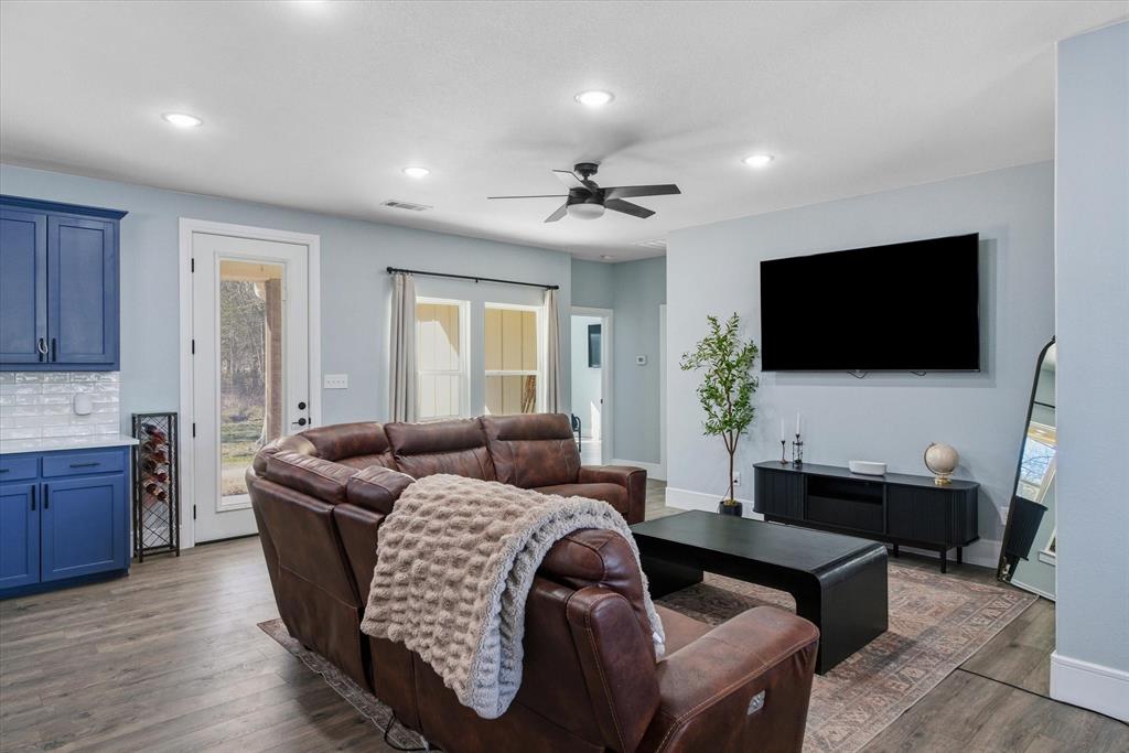 1159 Highway 276 Emory, TX 75440 - Photo 7 of 39 a living room with furniture and a flat screen tv