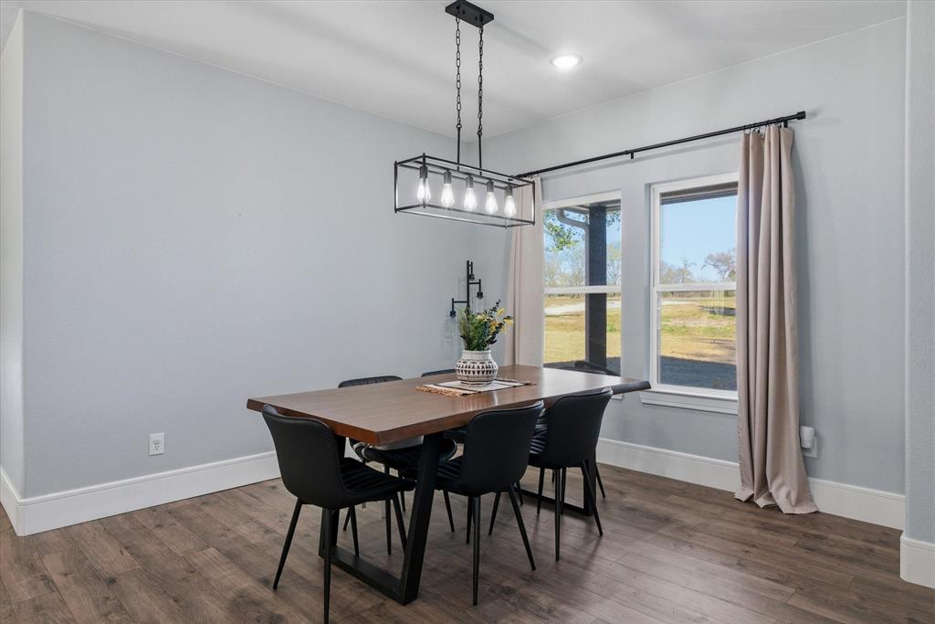1159 Highway 276 Emory, TX 75440 - Photo 8 of 39 a view of a dining room with furniture window and wooden floor