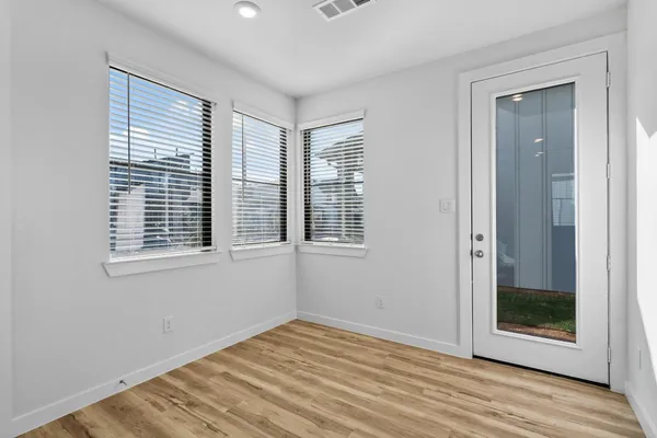 a kitchen with kitchen island a sink stainless steel appliances and cabinets