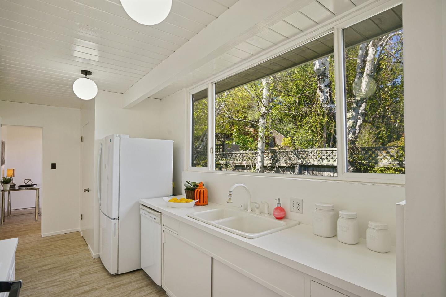 1775 Hunt Drive Burlingame, CA 94010 - Photo 19 of 37 a kitchen with a window and refrigerator