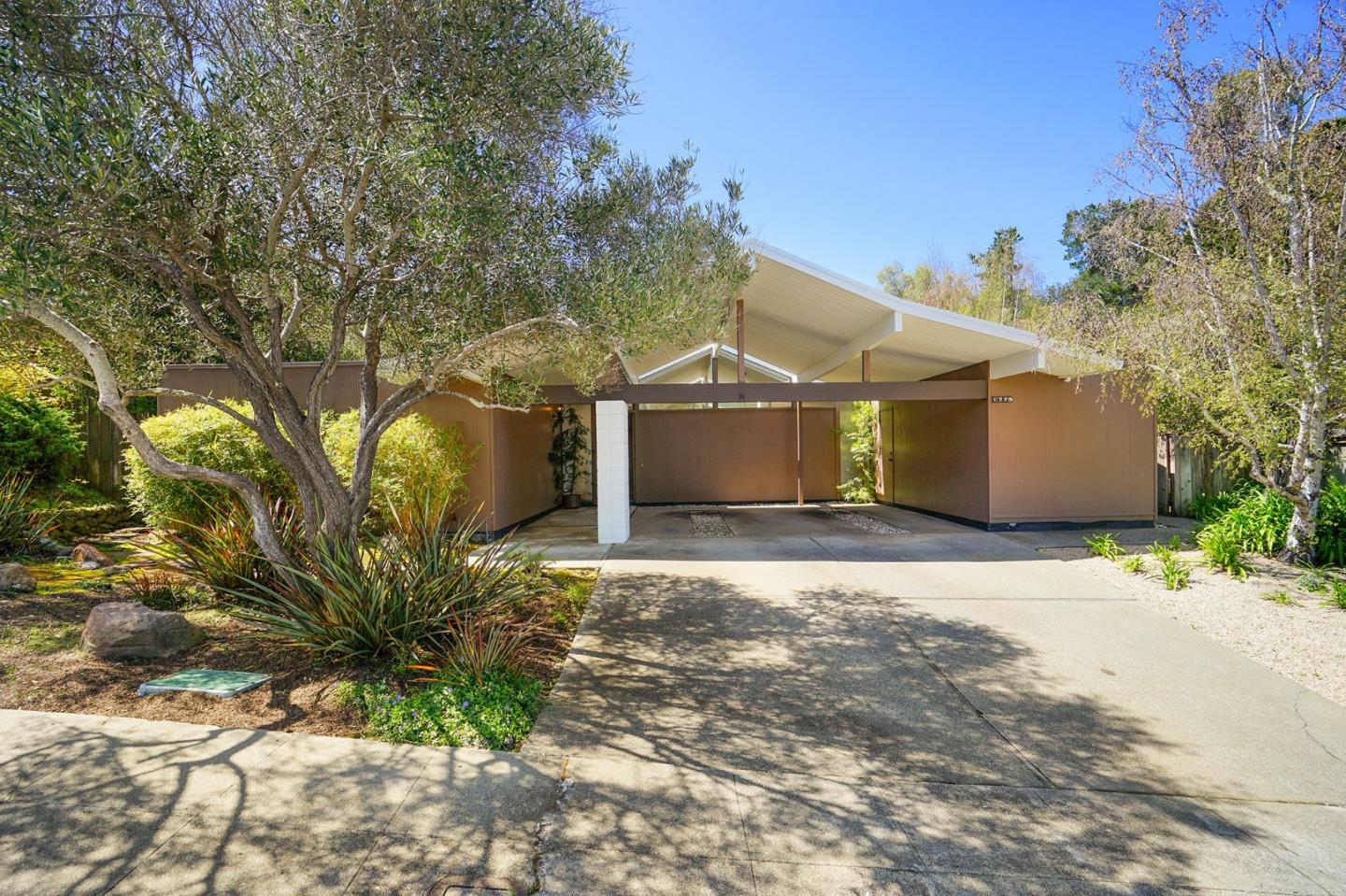1775 Hunt Drive Burlingame, CA 94010 - Photo 2 of 37 a view of a garage with a tree