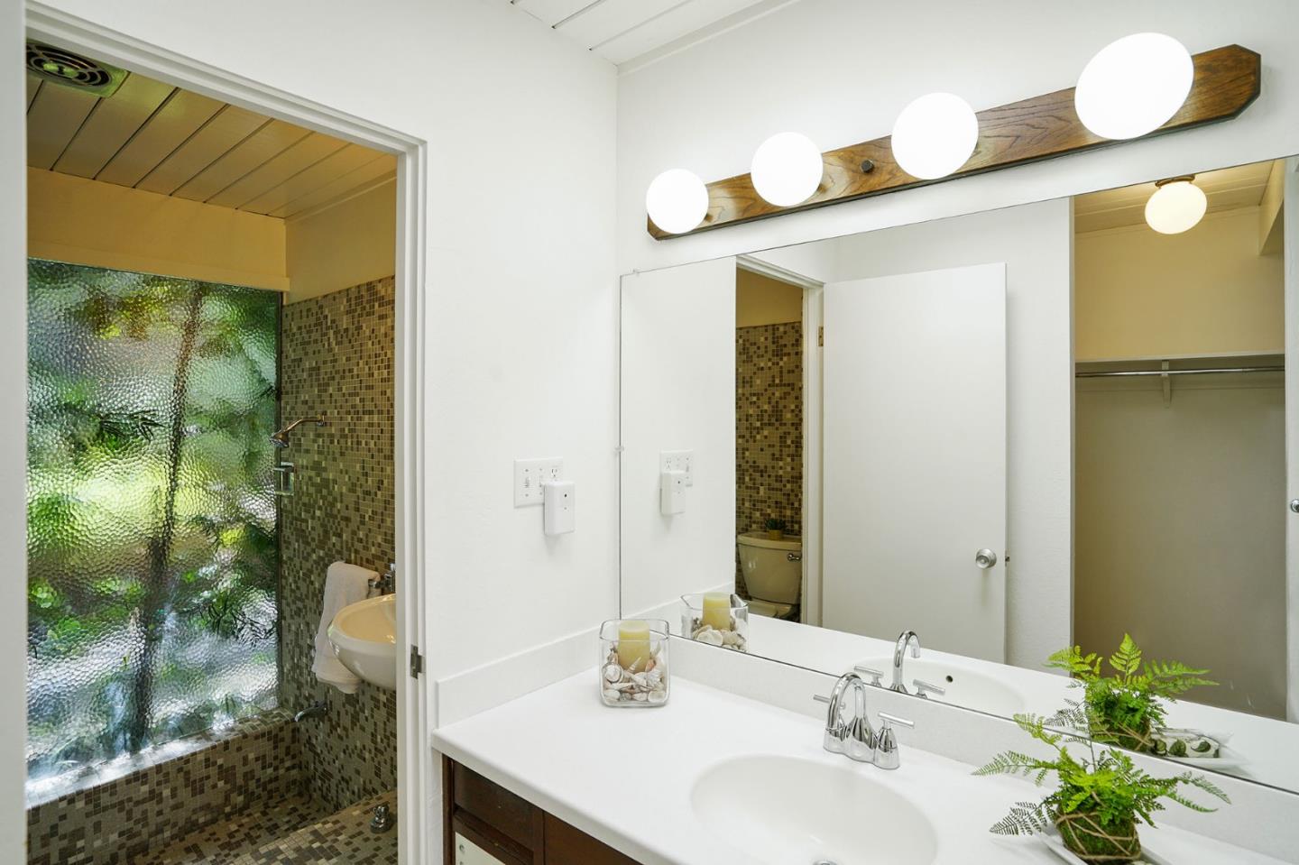 1775 Hunt Drive Burlingame, CA 94010 - Photo 26 of 37 a bathroom with a sink and a mirror