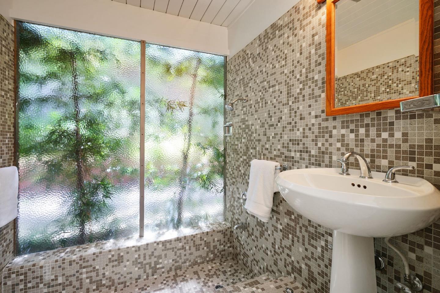 1775 Hunt Drive Burlingame, CA 94010 - Photo 27 of 37 a bathroom with a sink and mirror