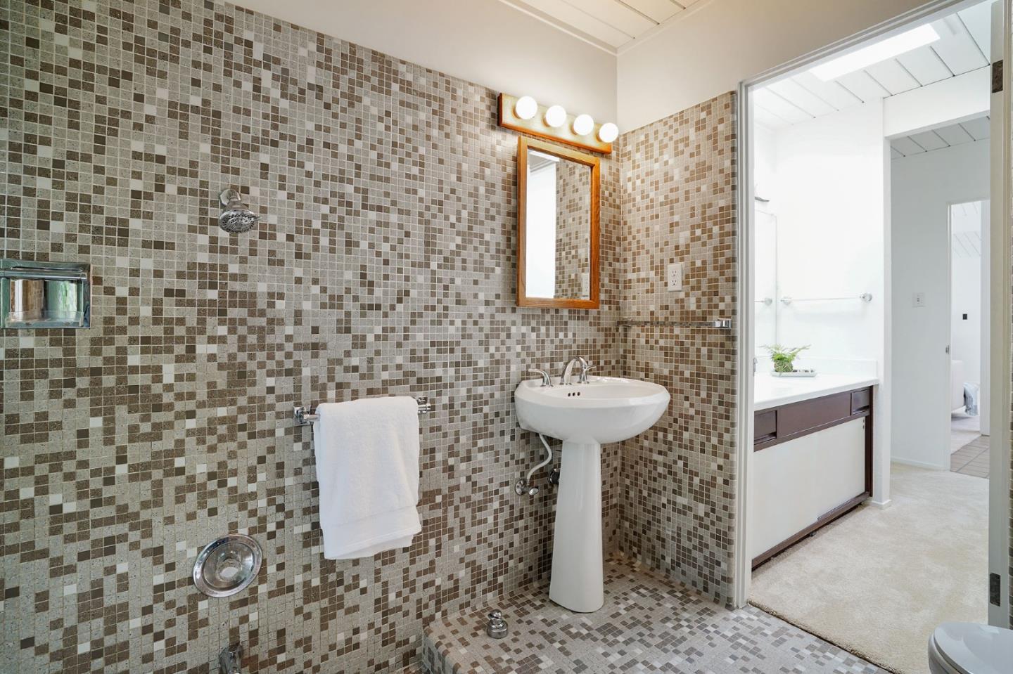 1775 Hunt Drive Burlingame, CA 94010 - Photo 28 of 37 a bathroom with a sink a toilet and mirror