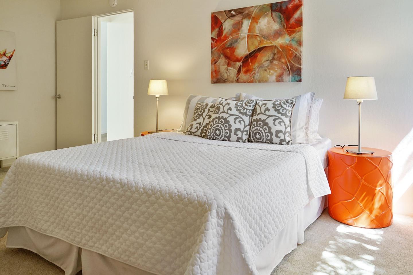 1775 Hunt Drive Burlingame, CA 94010 - Photo 30 of 37 a bedroom with a bed and lamp