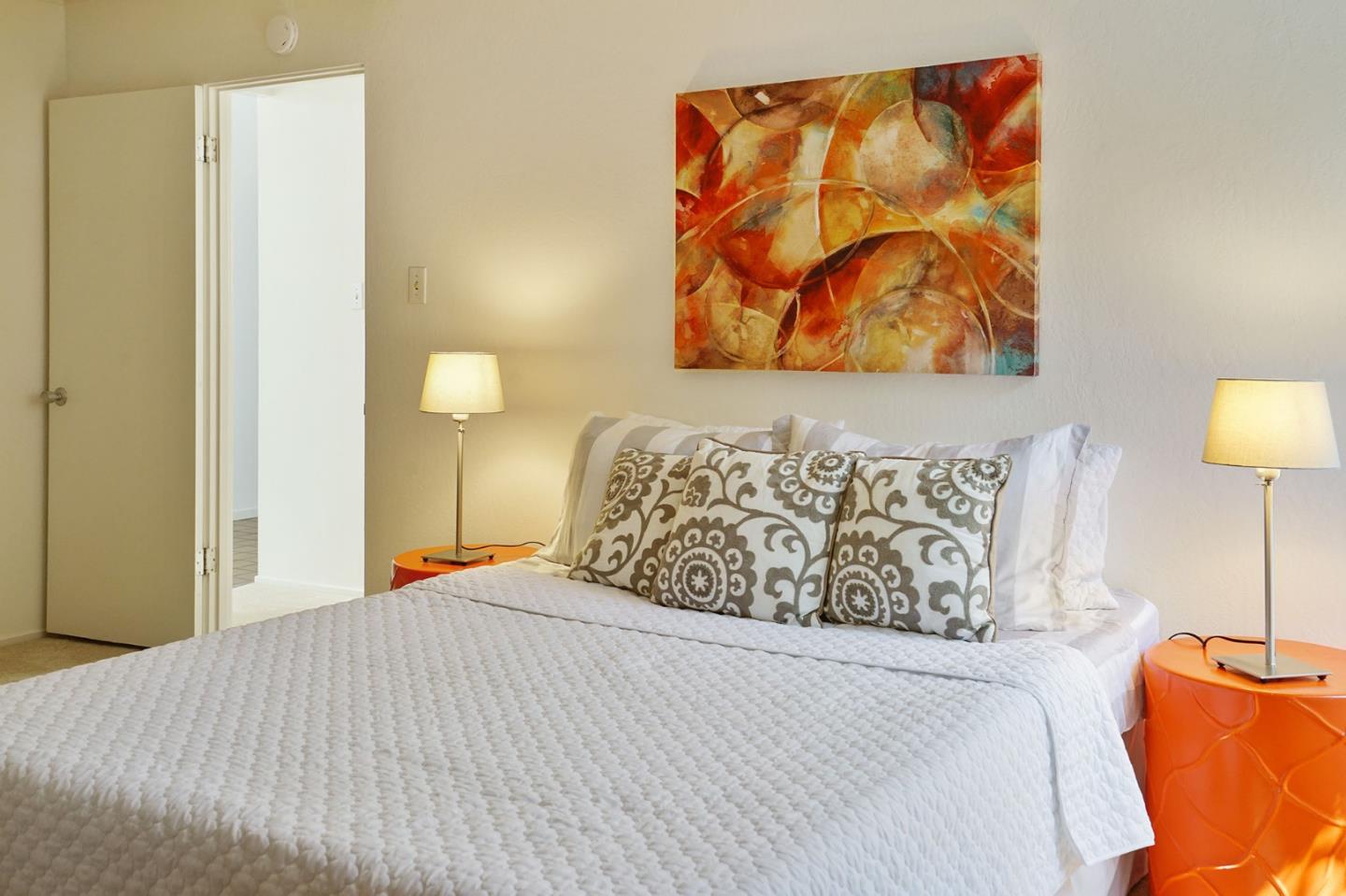 1775 Hunt Drive Burlingame, CA 94010 - Photo 32 of 37 a bedroom with a bed and a lamp