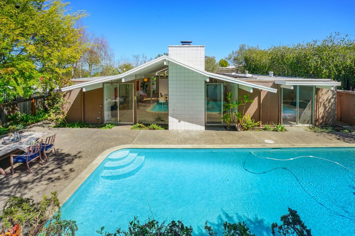 1775 Hunt Drive Burlingame, CA 94010 - Photo 4 of 37 a view of a house with pool and chairs