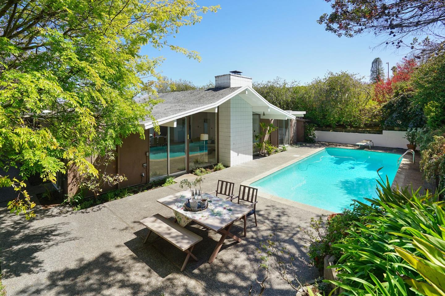 1775 Hunt Drive Burlingame, CA 94010 - Photo 6 of 37 a view of a patio with table and chairs potted plants with wooden floor and fence