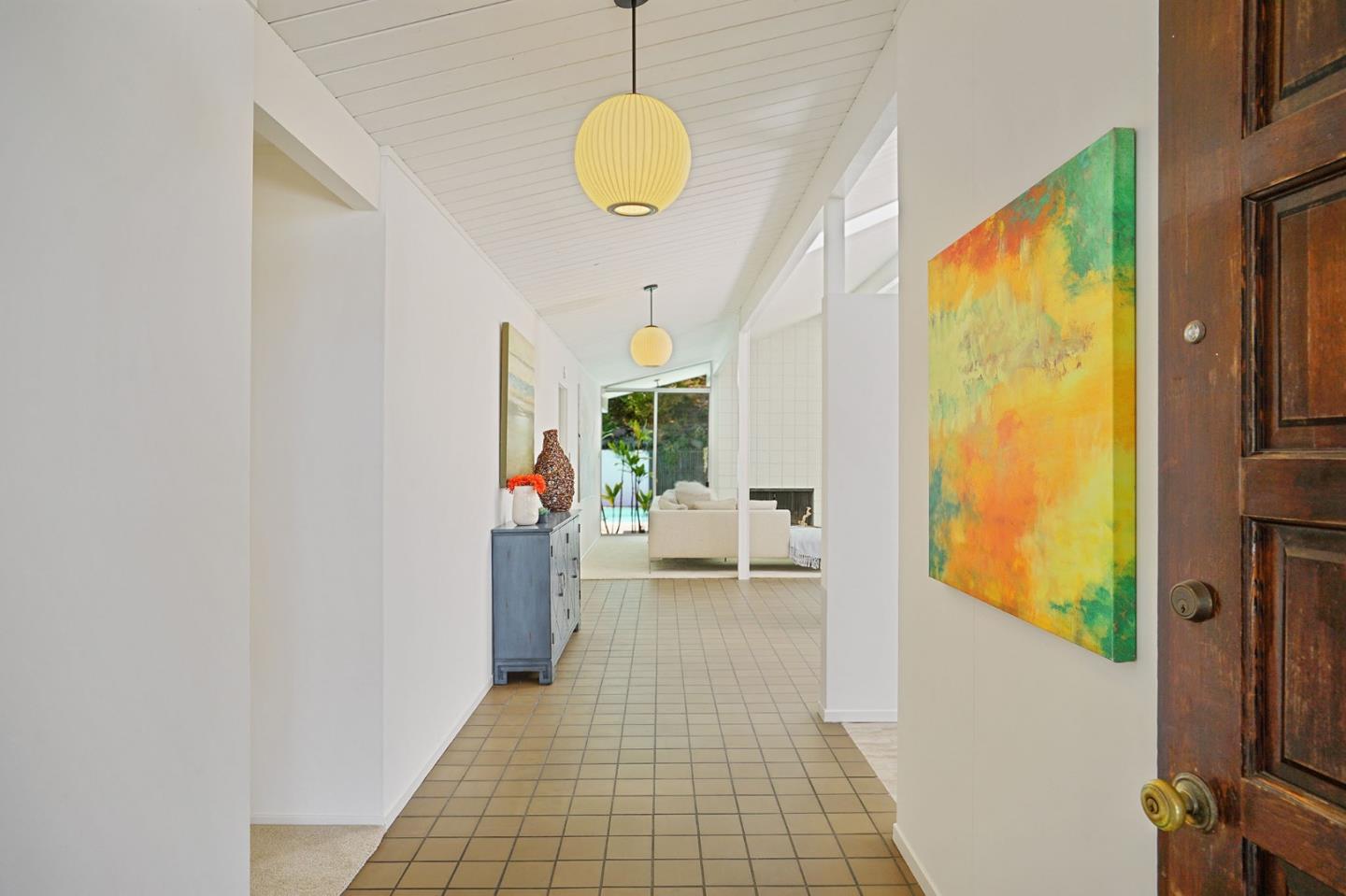1775 Hunt Drive Burlingame, CA 94010 - Photo 9 of 37 a hallway with a large window and couch