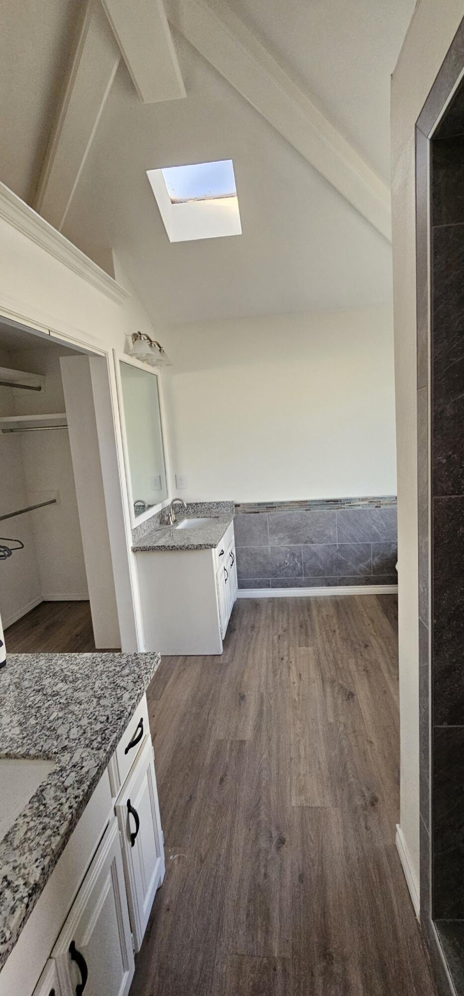 5718 95th Street Lubbock, TX 79424 - Photo 11 of 16 a view of a kitchen from the hallway