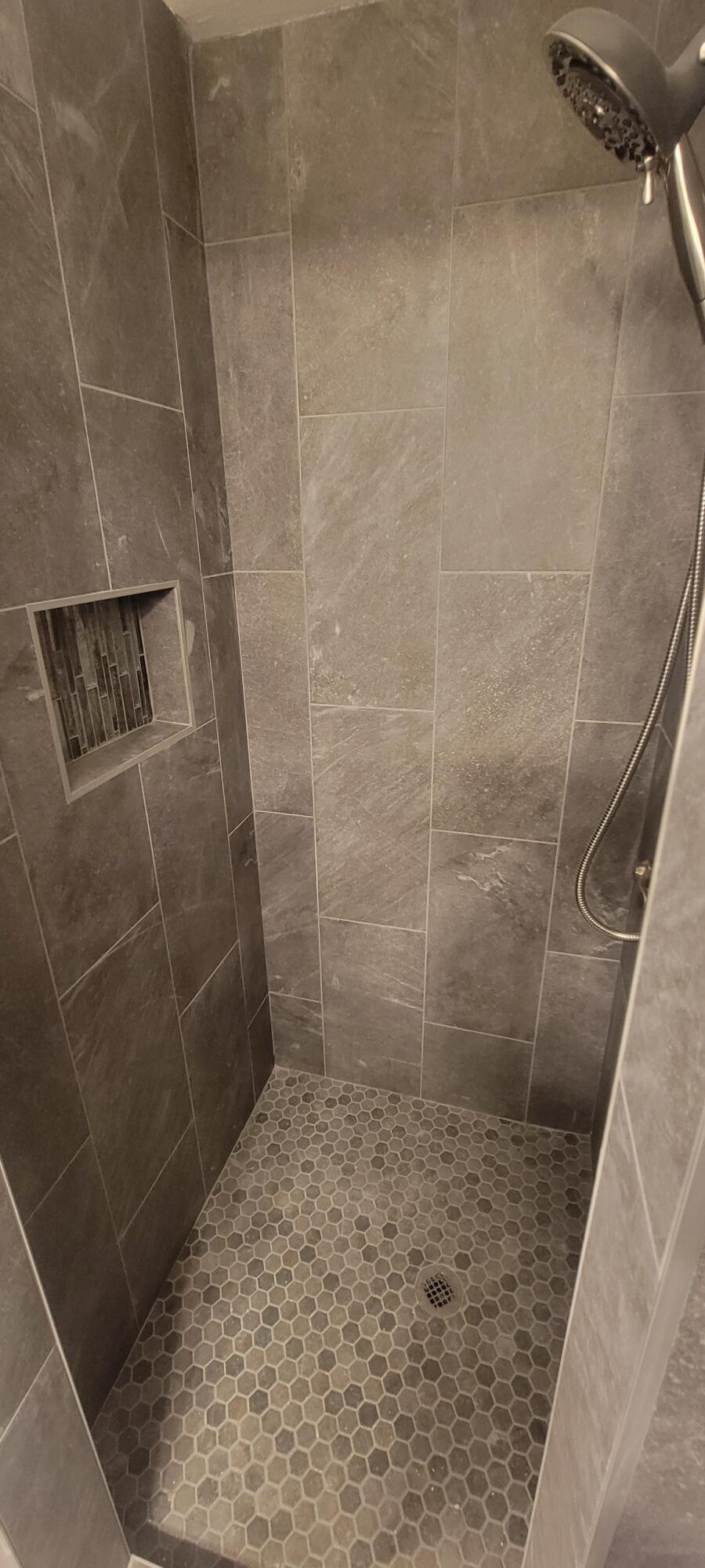 5718 95th Street Lubbock, TX 79424 - Photo 13 of 16 a bathroom with a shower