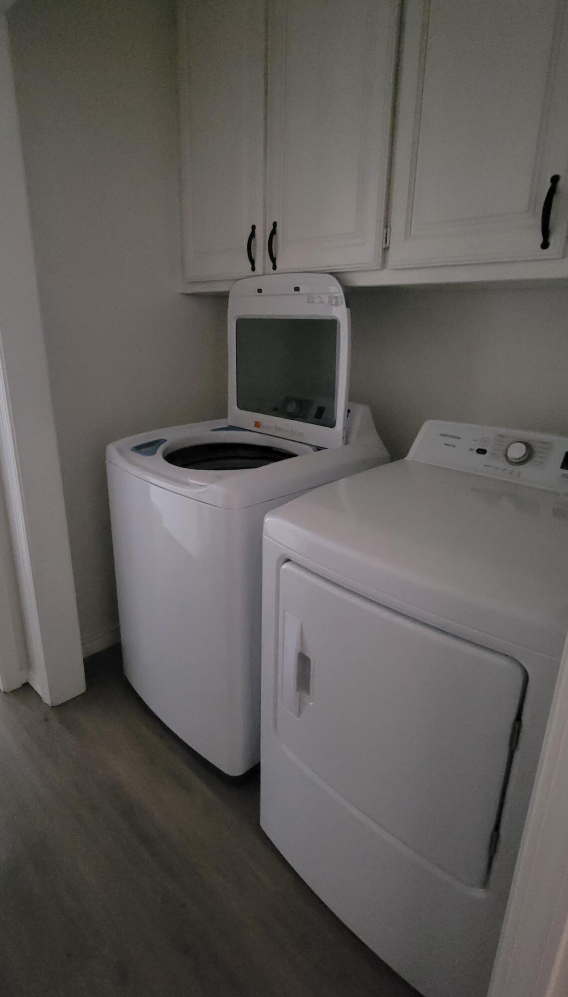 5718 95th Street Lubbock, TX 79424 - Photo 16 of 16 a utility room with dryer and washer