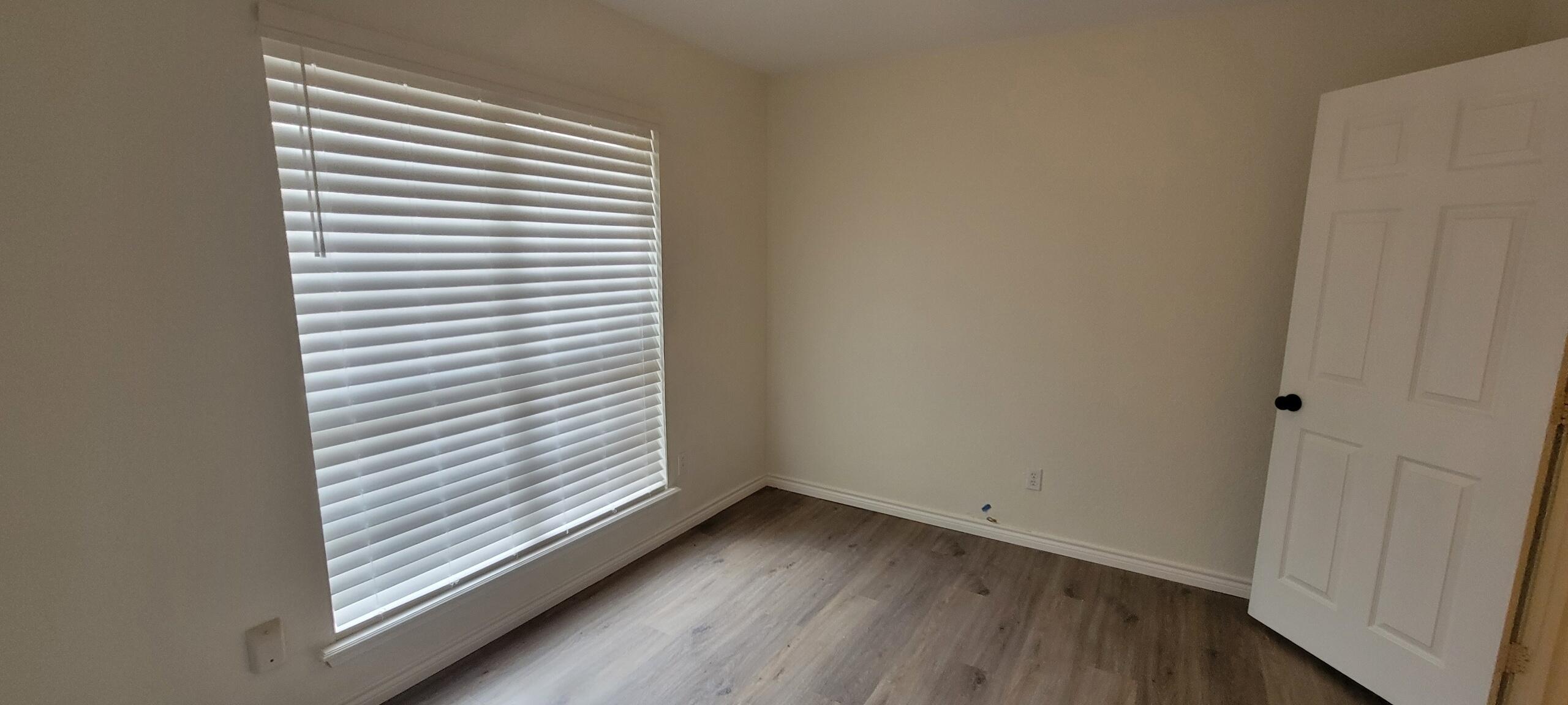 5718 95th Street Lubbock, TX 79424 - Photo 7 of 16 a view of a room that has a window