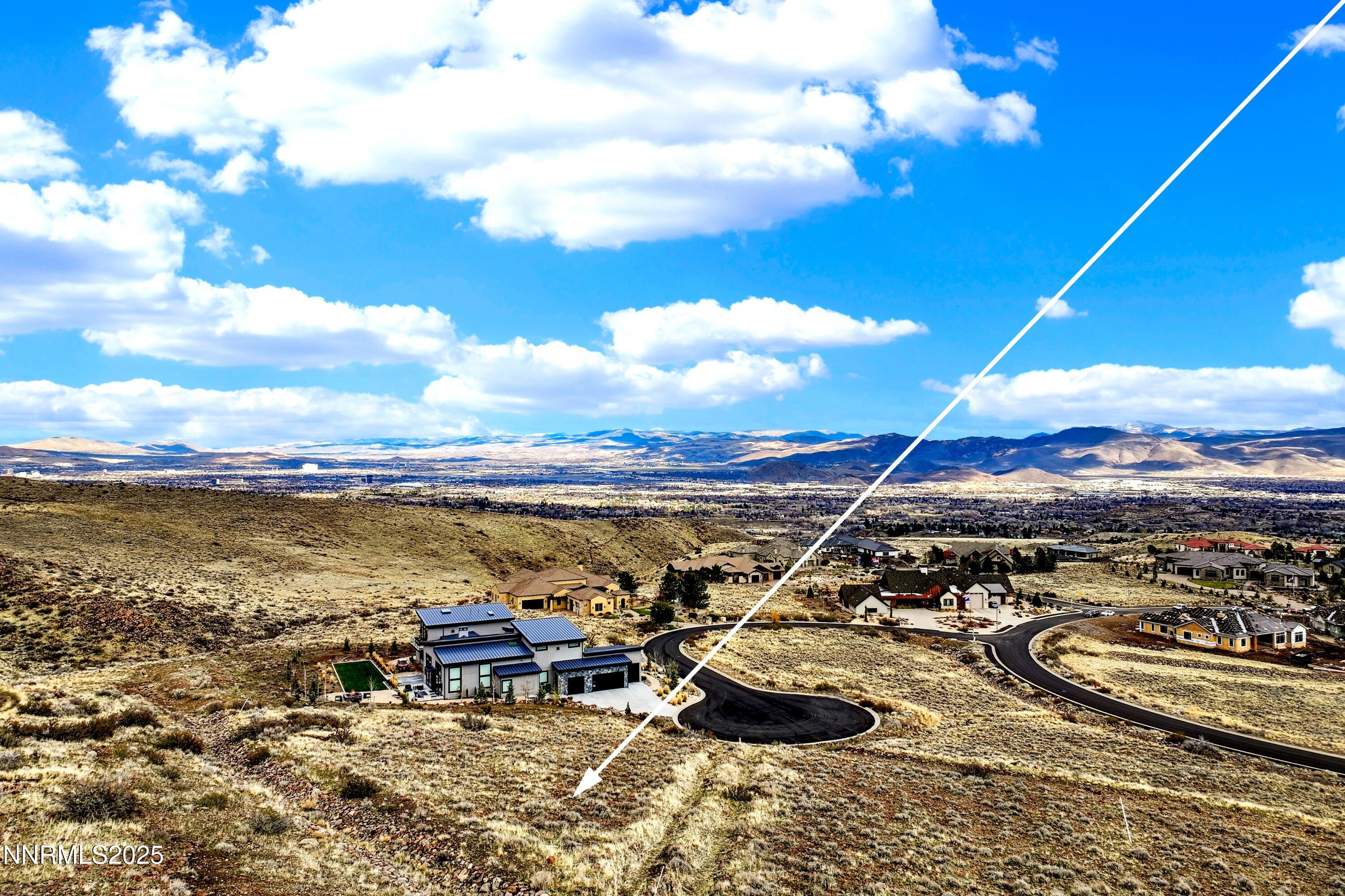 4255 Drop Tine Court Reno, NV 89511 - Photo 2 of 15 a view of a terrace with lawn chairs and ocean view