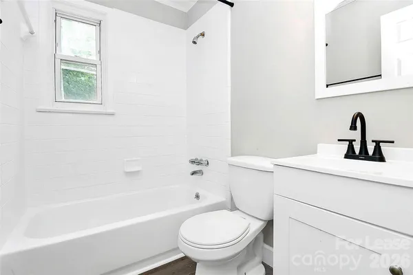 a bathroom with a sink a toilet and a bathtub