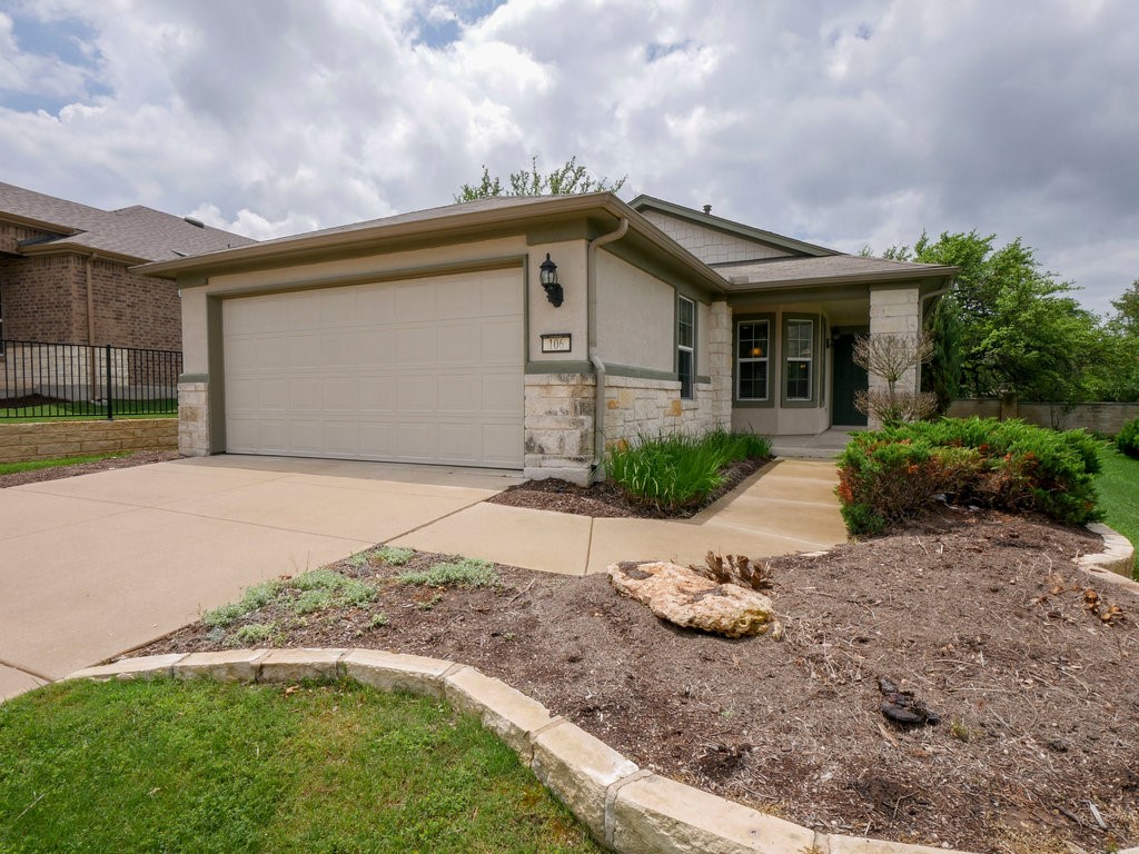 106 Coyote Trail Georgetown, TX 78633 - Photo 1 of 1 a front view of house with yard and trees in the background