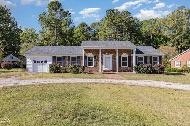 a front view of a house with swimming pool