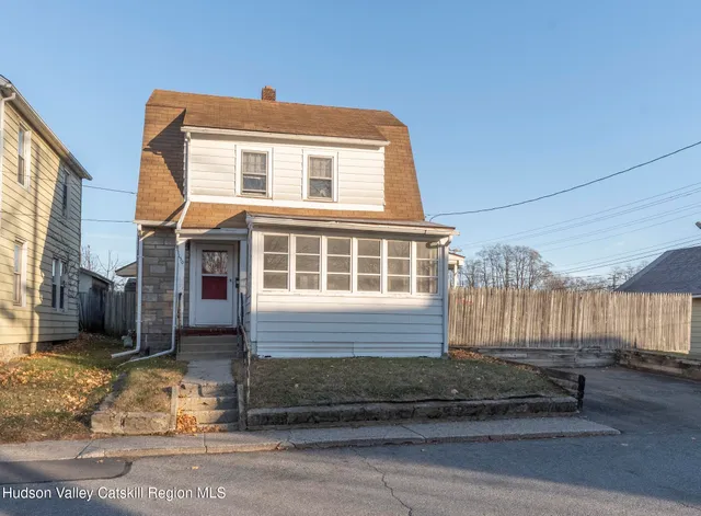 a front view of a house with a garage