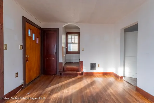 a bedroom with a bed and a chair