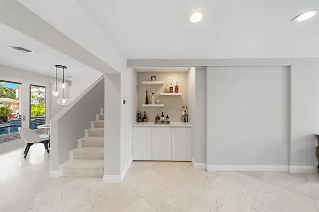a view of a backyard with plants and a patio
