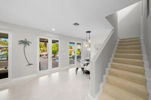 a view of swimming pool with outdoor seating and plants