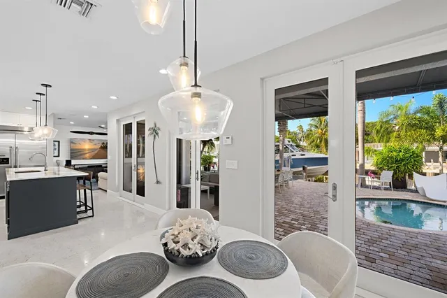 a living room with furniture a large window and a rug