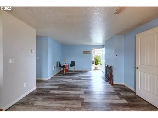 a view of a living room and hardwood floor